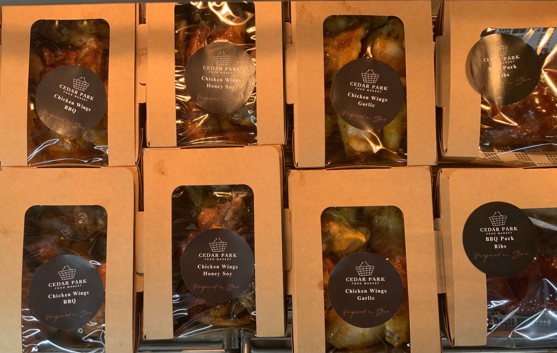 Assorted Packaged Baked Goods in Cardboard Trays — Cedar Park Supermarket In Taranganba, QLD