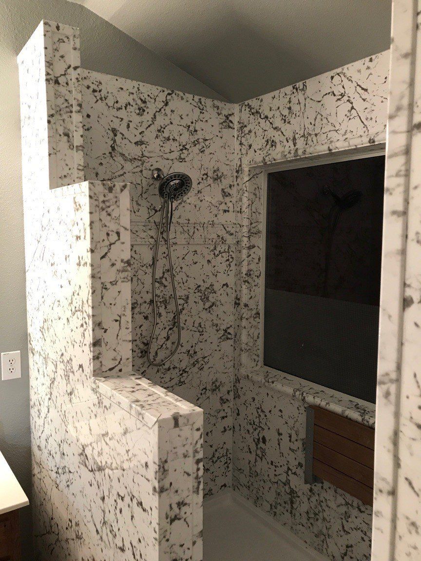 Currara Marble Wall Surround with Santa Fe Listello Accent Trim