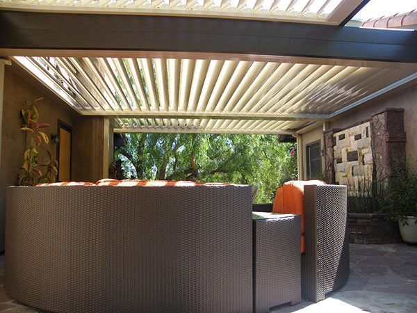 Equinox Louvered Patio Cover with Oversized Outdoor Furniture — Fresno, CA — R.F.M.C Construction Inc