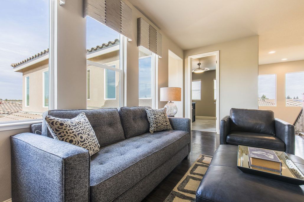 Bay View Series Windows in Living Room with Gray Couch and Ottoman