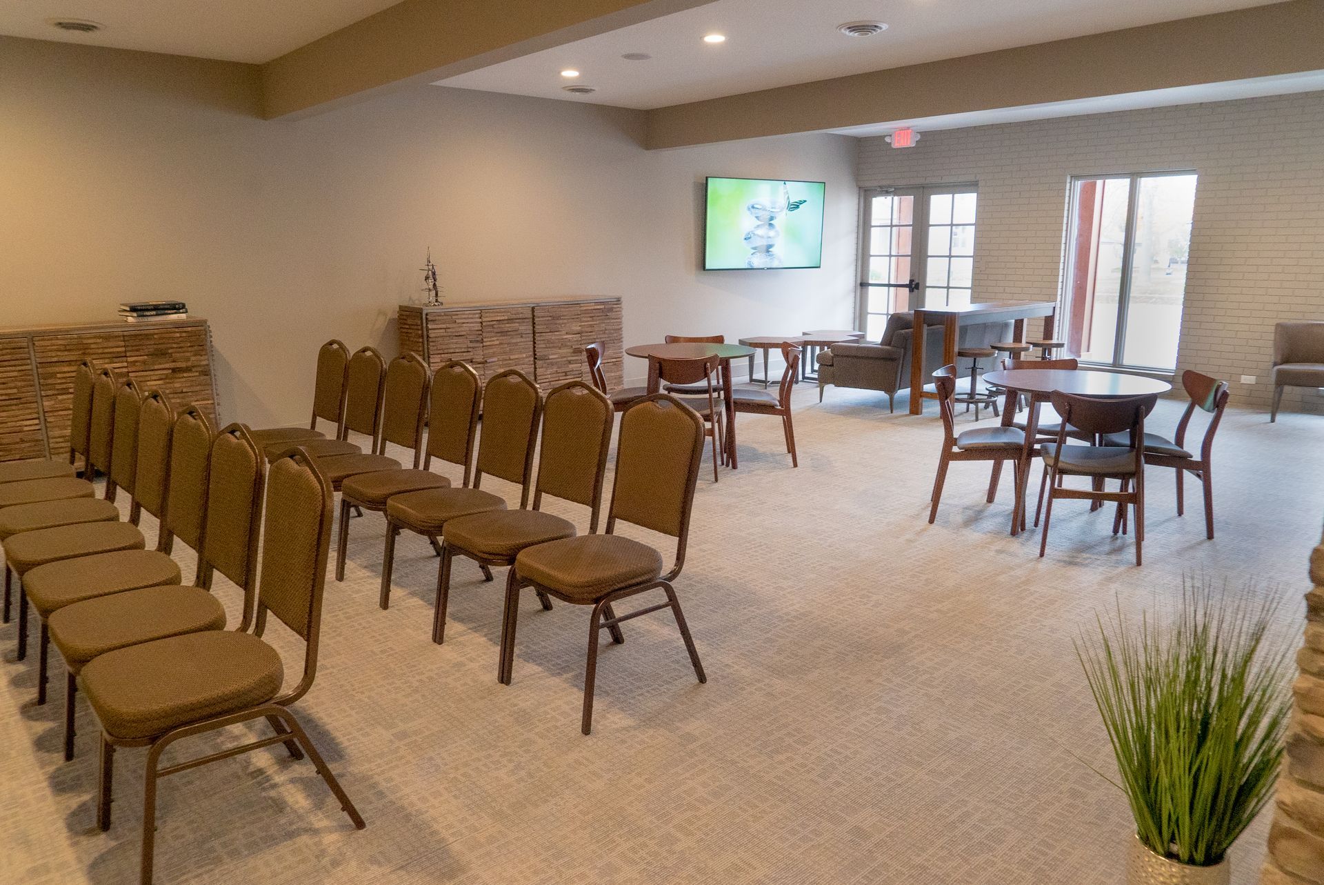 A large room with a lot of chairs and tables.