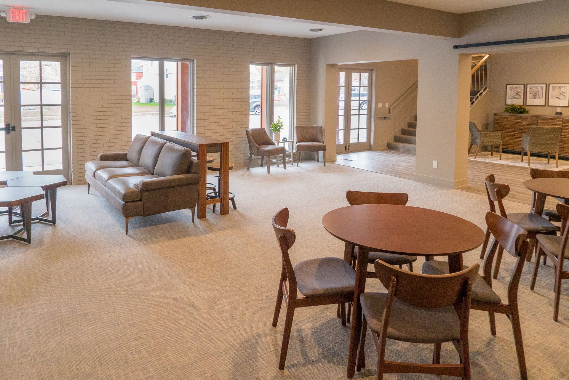 A living room with tables and chairs and a couch.