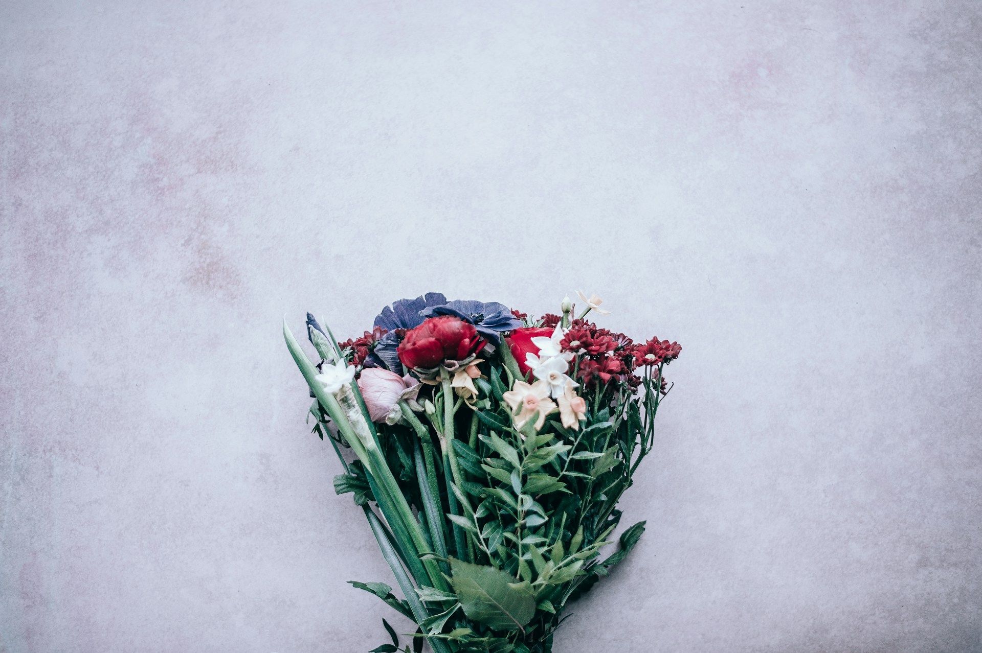 Bouquet of colorful flowers arranged as a heartfelt tribute for remembrance and sympathy. 