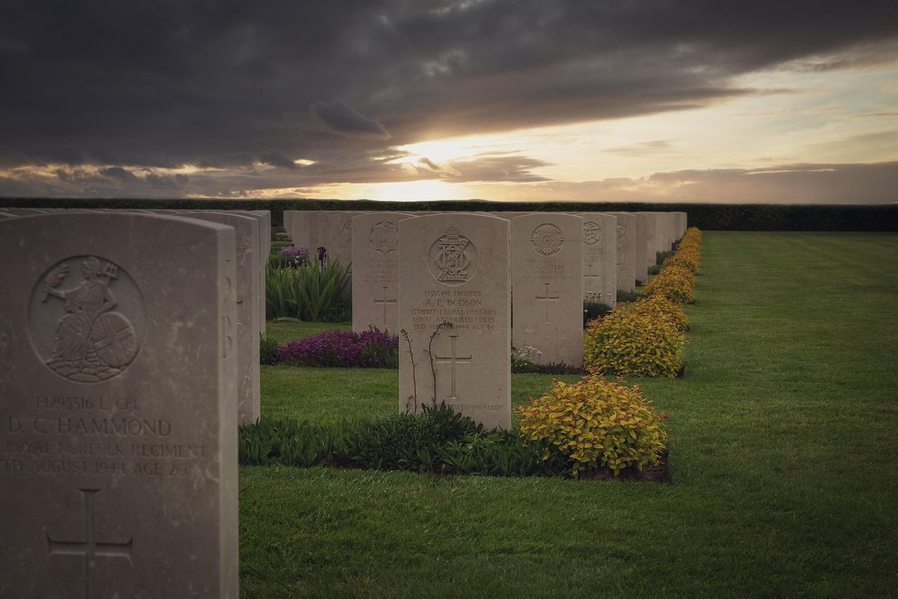 Wide view of Normandy memorial cemetery monument honoring fallen soldiers and legacy of sacrifice.
