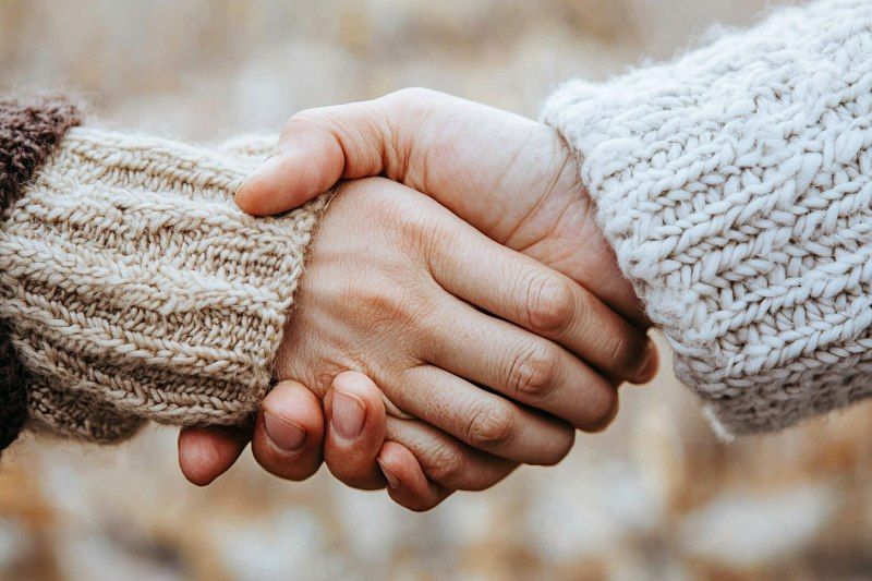 Warm handshake offering comfort and support, reflecting compassionate care from a Prior Lake, MN funeral home and cremations