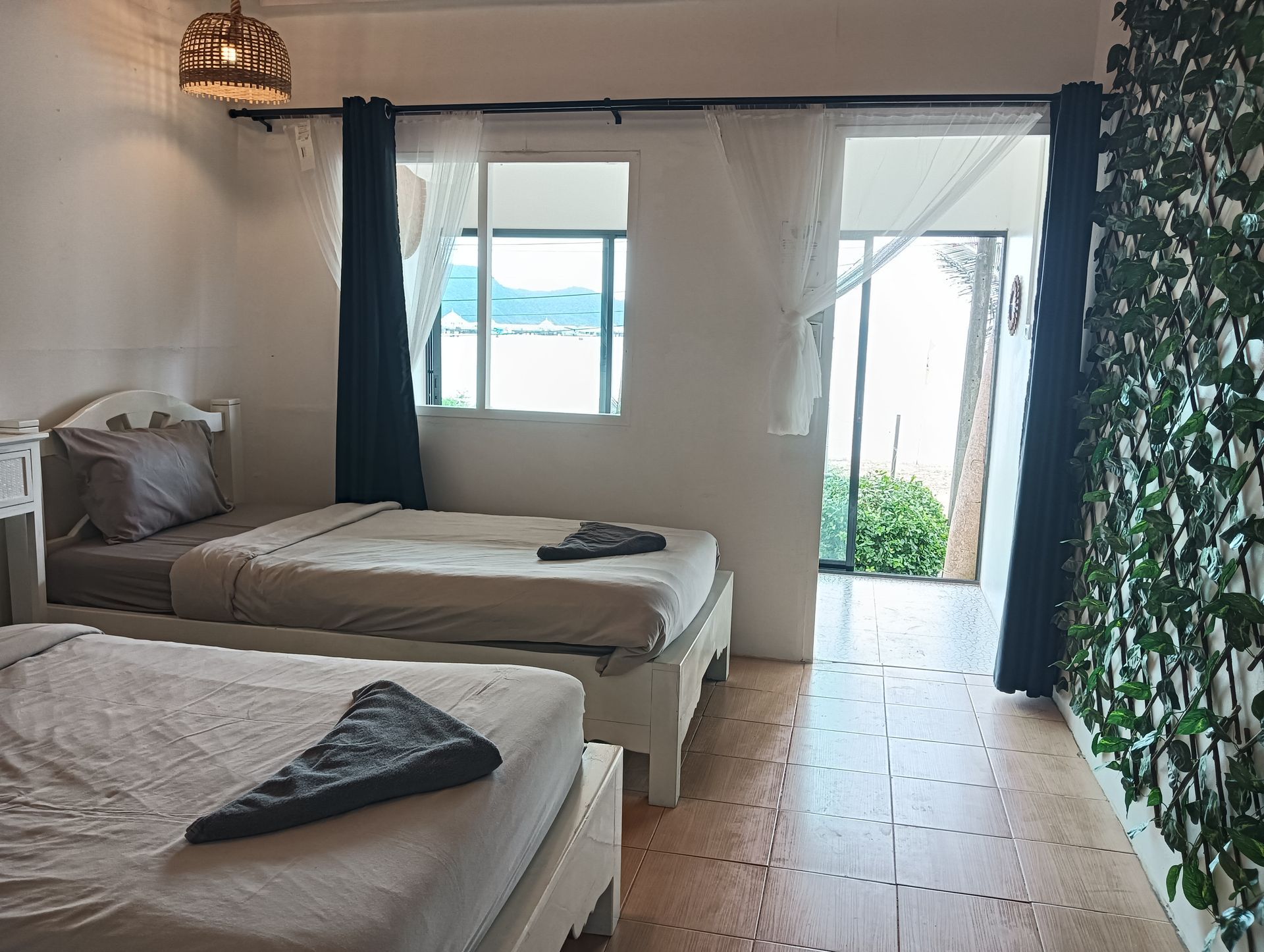 twin bed in garden room with patio