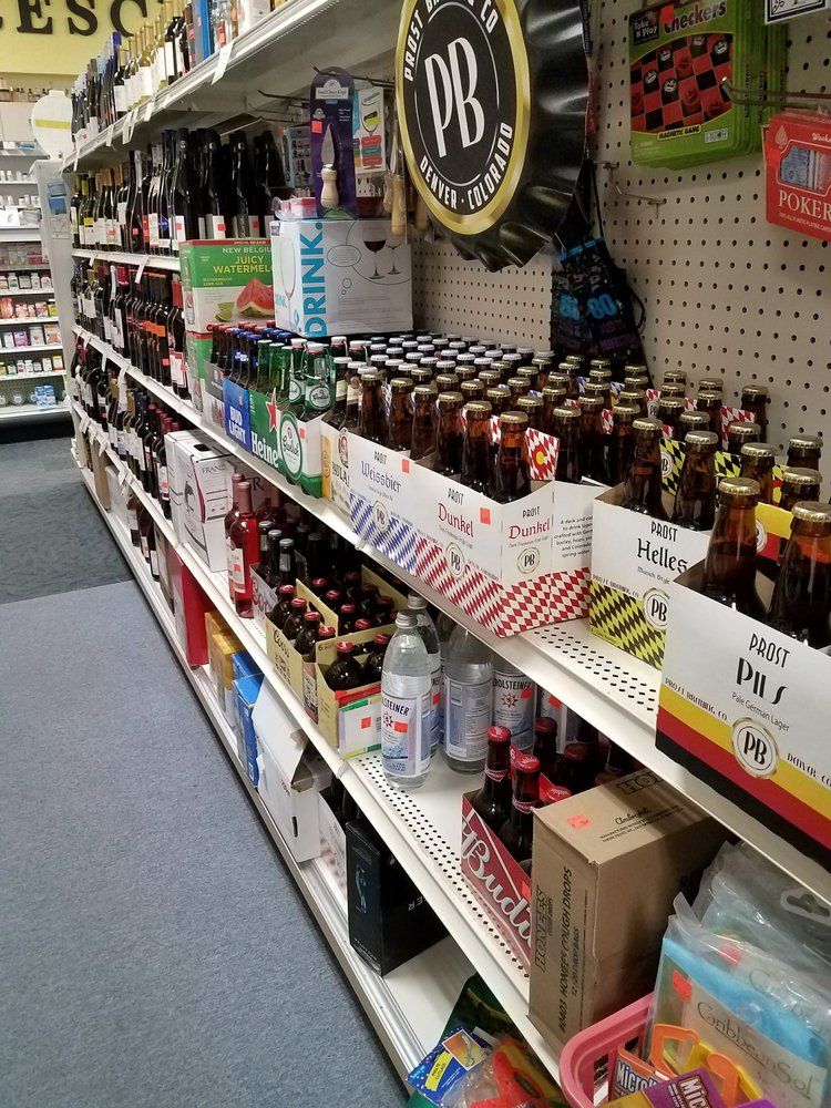 Shelves in a store filled with various beer bottles and cans.