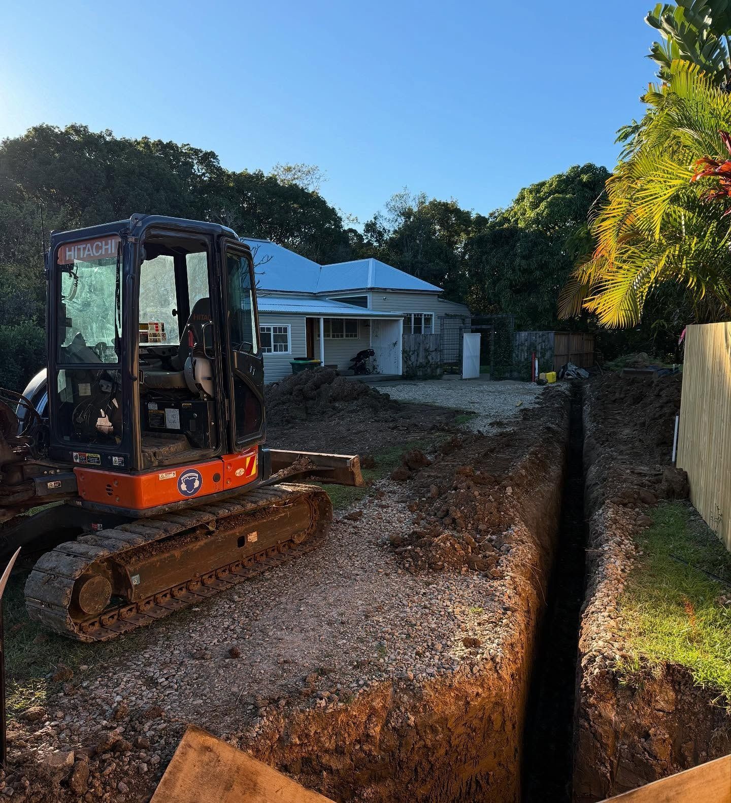 Mini Excavator Digging a Trench Near a House  — Bigfoot Earthmoving In Byron Bay, NSW