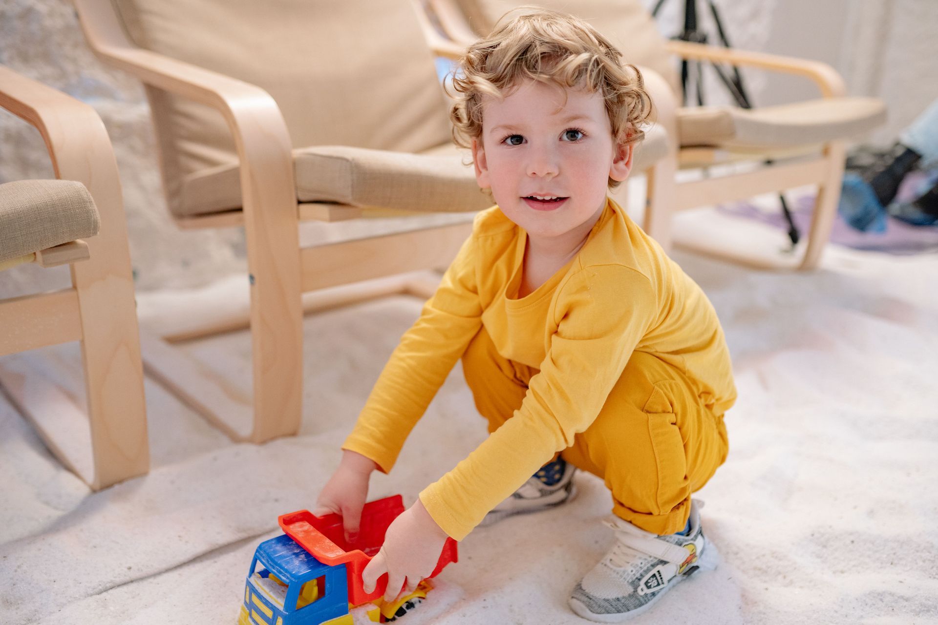 Professional caregiver supporting a child's emotional growth through play.