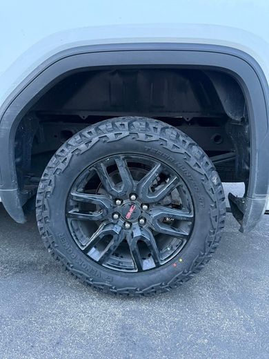 A close up of a tire on a truck.