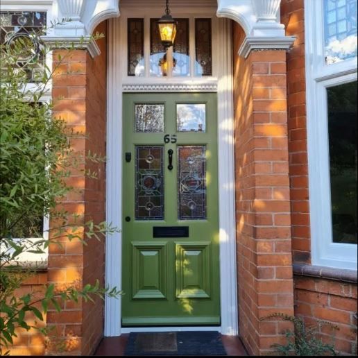 green door with stained glass