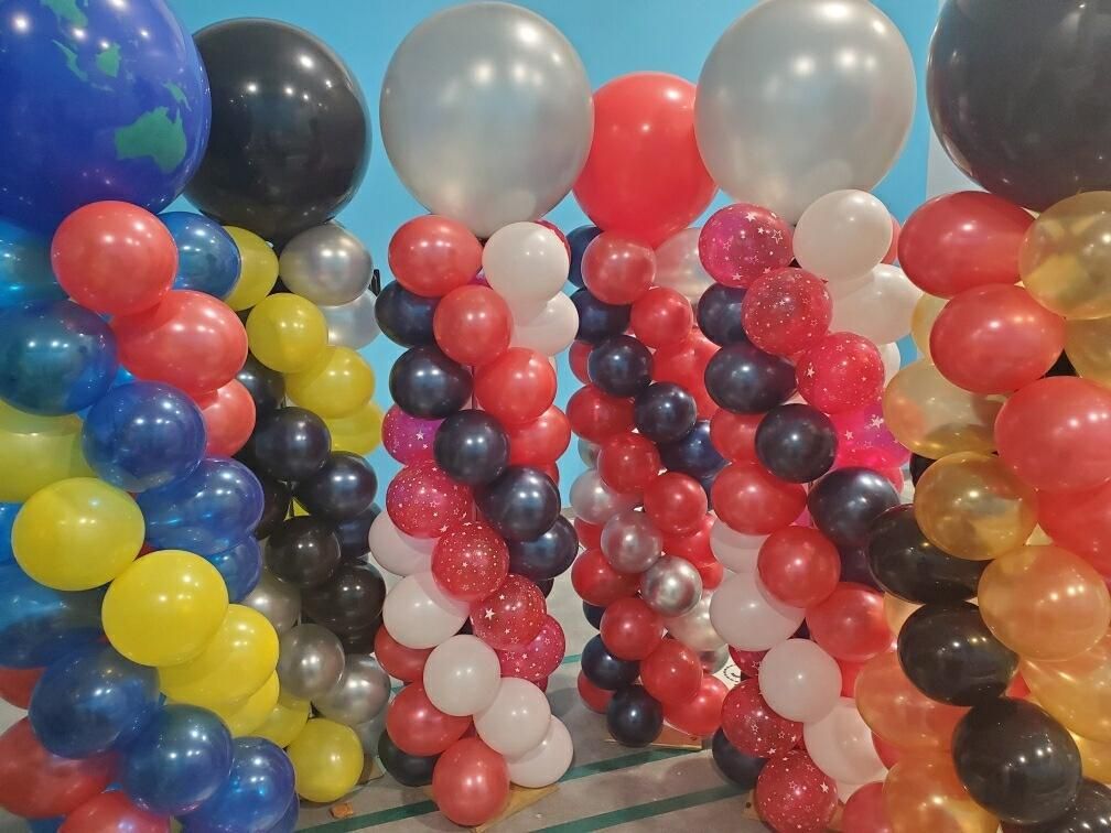 A bunch of balloons are stacked on top of each other