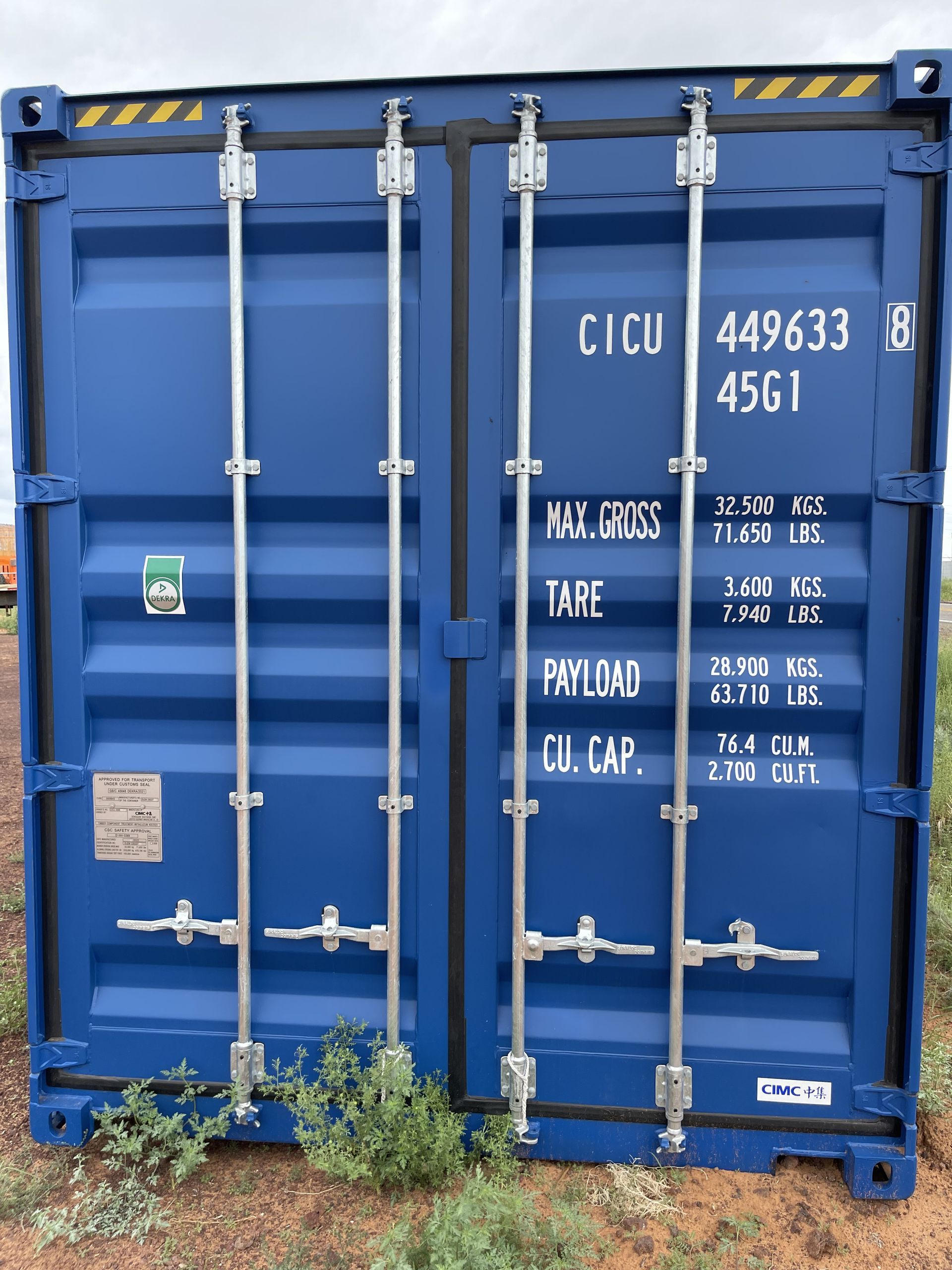 A blue shipping container with the number 449633 on it