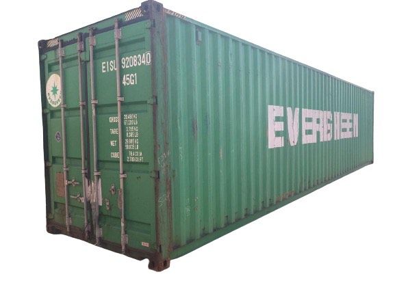 A green shipping container with the word evergreen on it