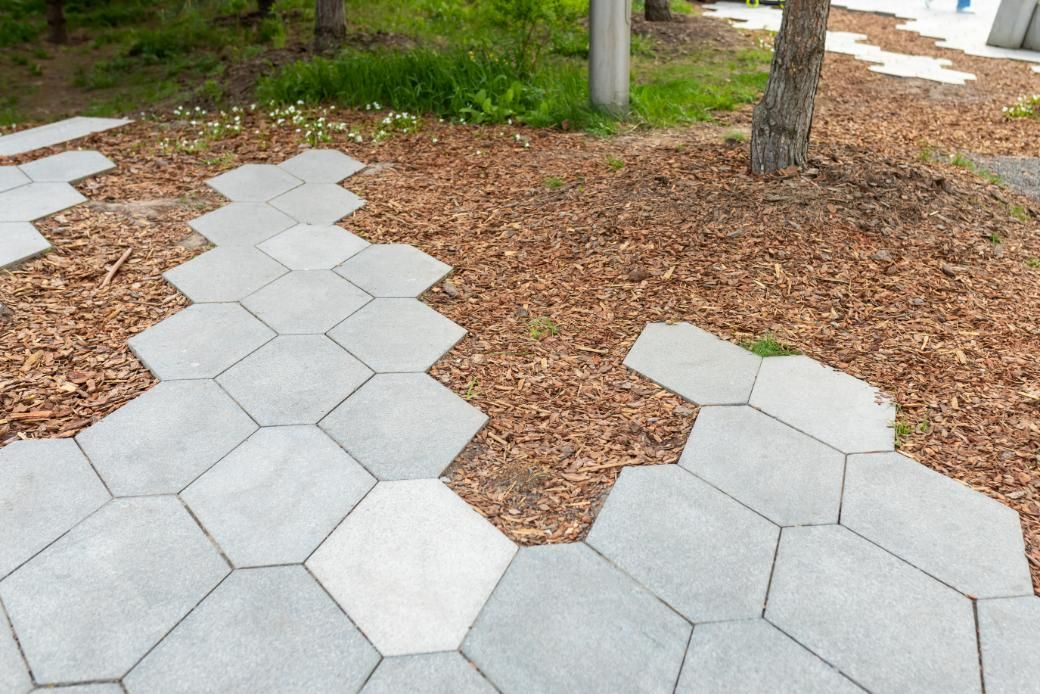 A Walkway Made of Hexagonal Tiles in A Park — S & L Sand & Gravel in Lismore, NSW