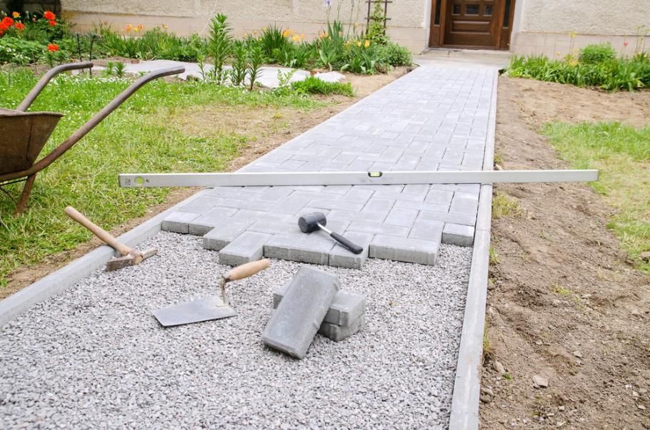 A Walkway Is Being Built in A Yard with Bricks and Tools — S & L Sand & Gravel in Kyogle, NSW