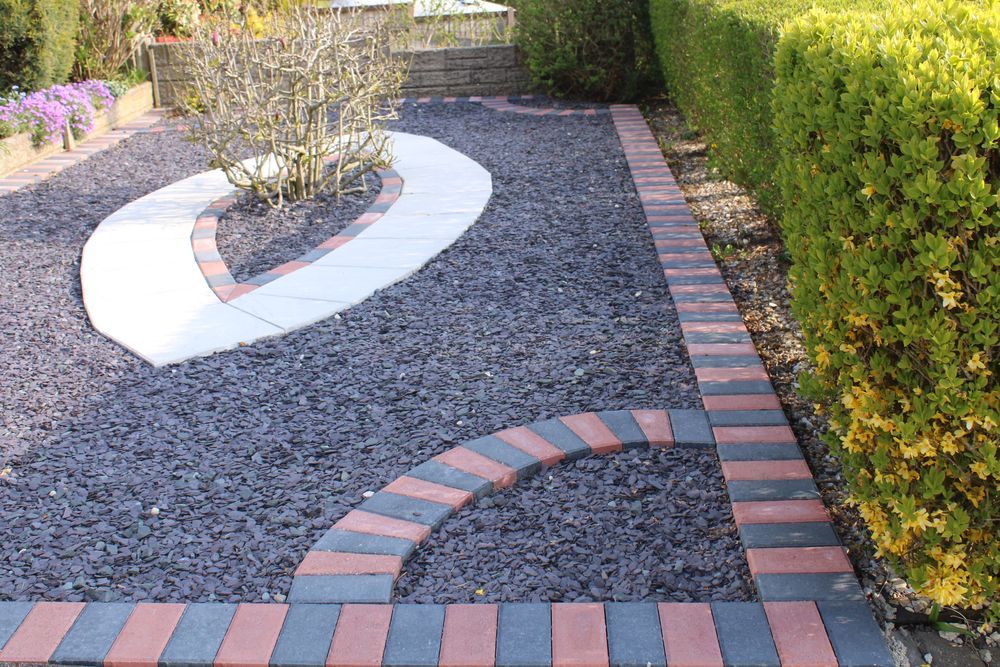 Modern Backyard With Gravel And Concrete Pavers