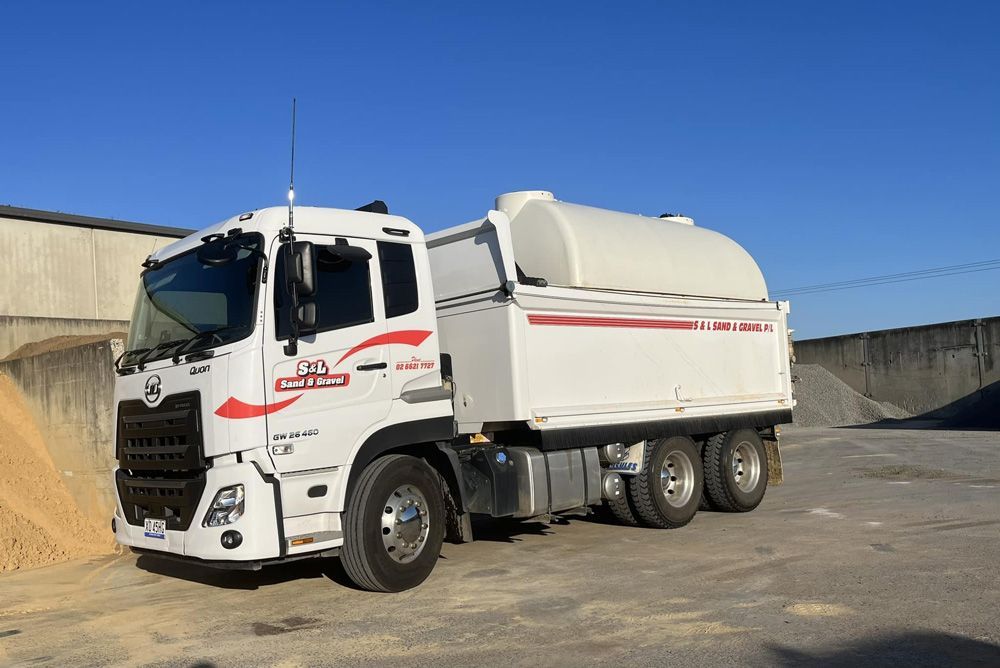 Company Vehicle Carrying Landscape Supplies