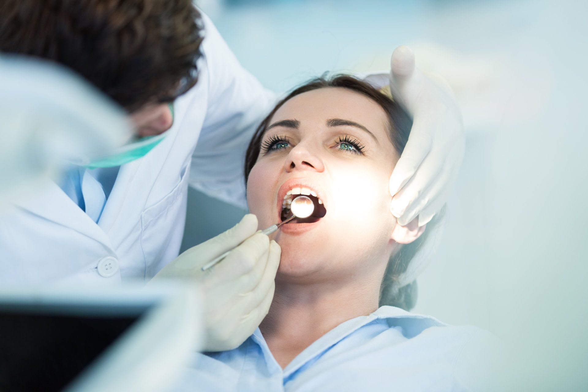 Dentist checking the patient's teeth — Ashland and Ruther Glen, VA — Ashland Family Dentistry