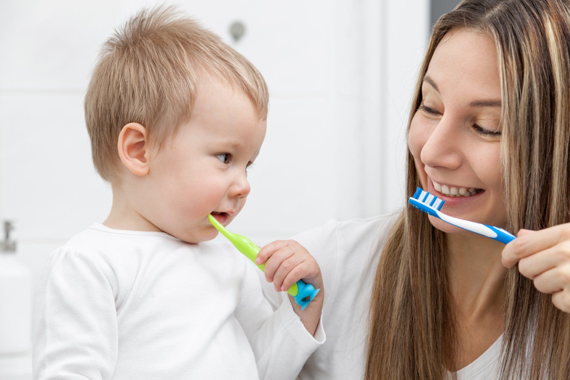 Mother and son brushing their teeth — Ashland and Ruther Glen, VA — Ashland Family Dentistry