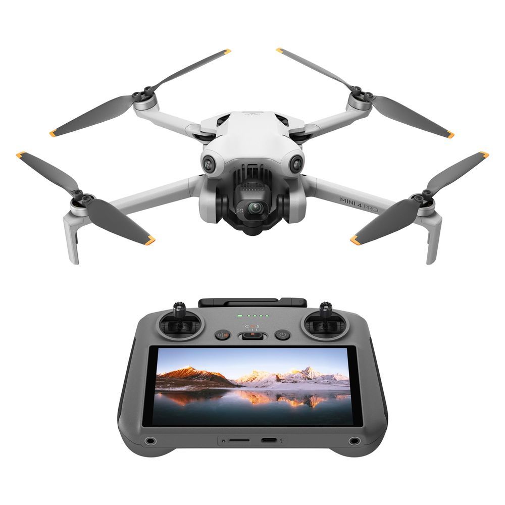 White quadcopter drone with camera and a remote controller displaying a landscape on its screen