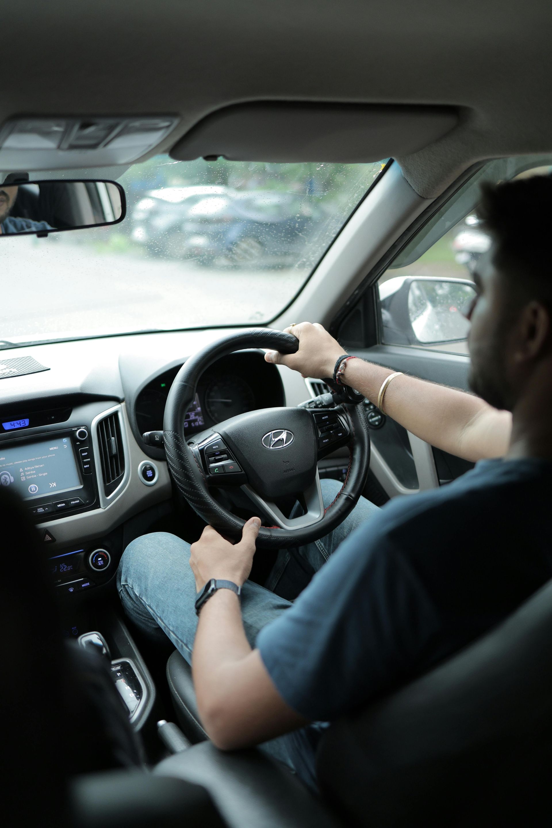 A real estate agent showing a document to a couple in a bright, modern room.