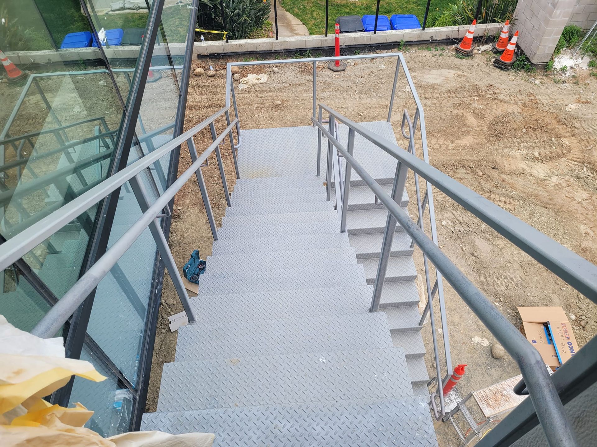 A set of stairs leading up to a building under construction.