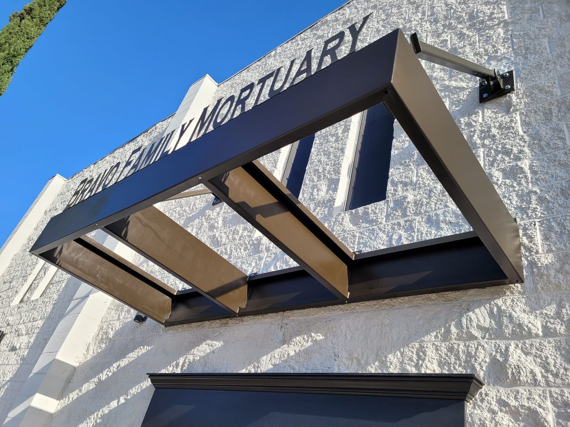 A canopy on the side of a building with the word mortuary on it