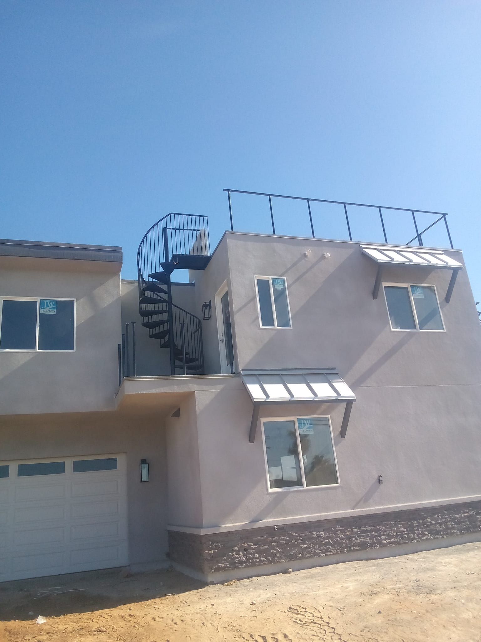 A house with a spiral staircase on top of it