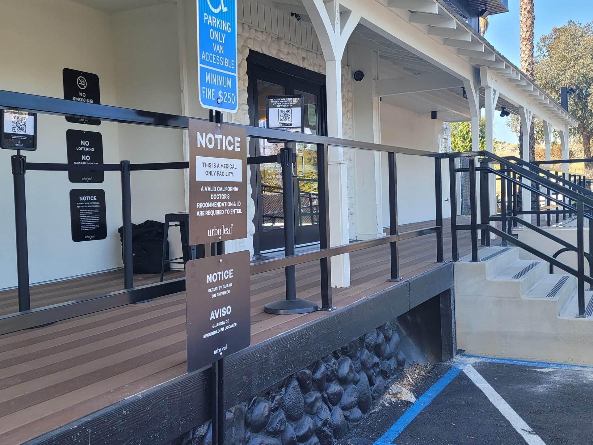 A building with a ramp and a sign that says notice