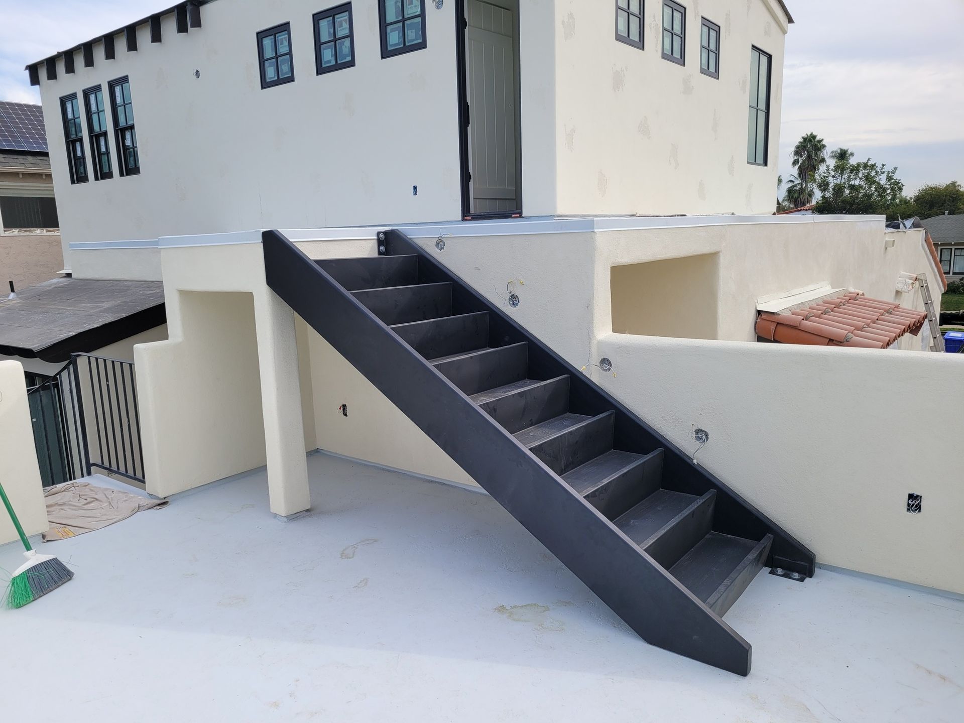 A set of stairs leading up to a white building