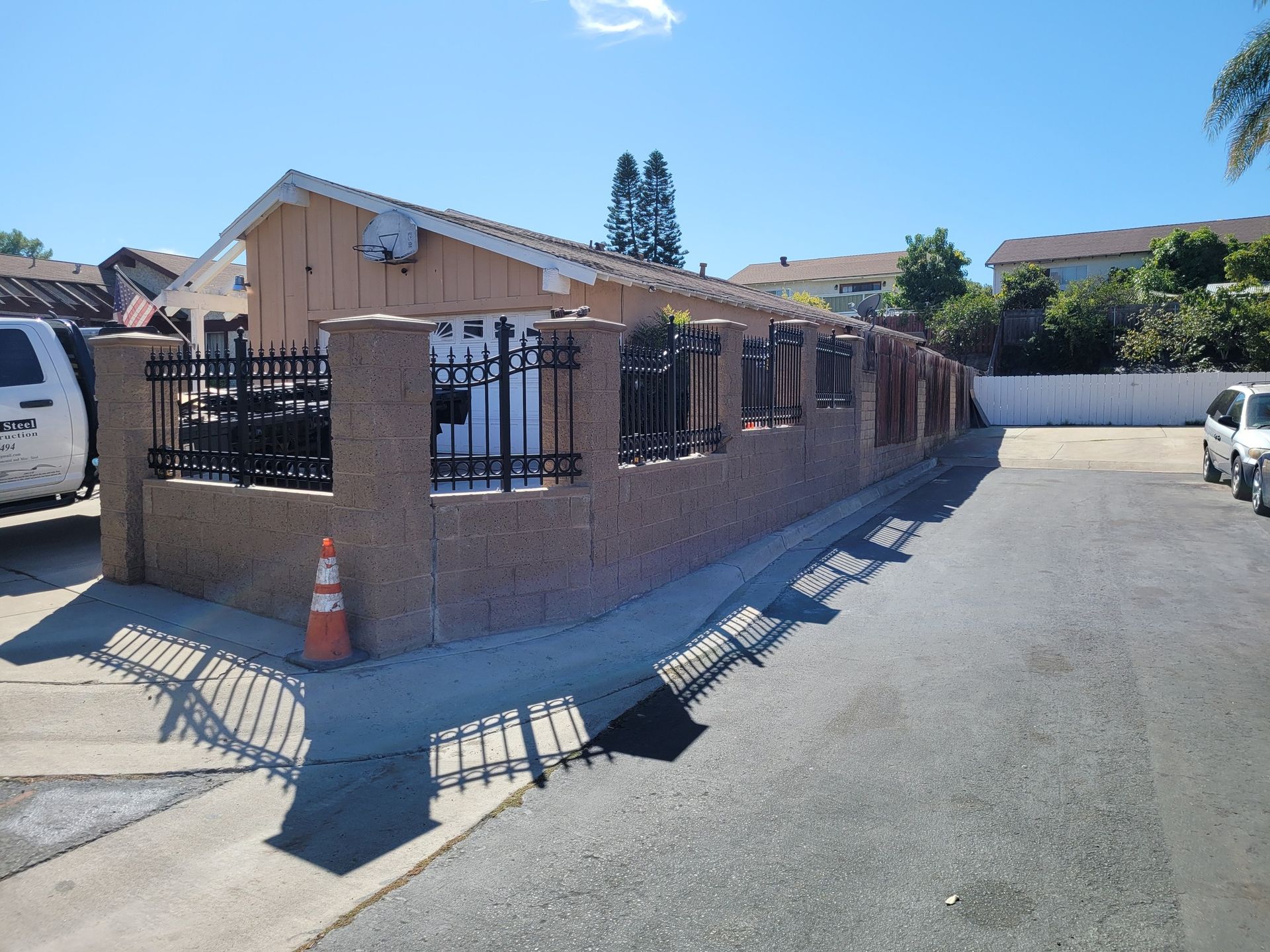 A white van is parked in front of a building