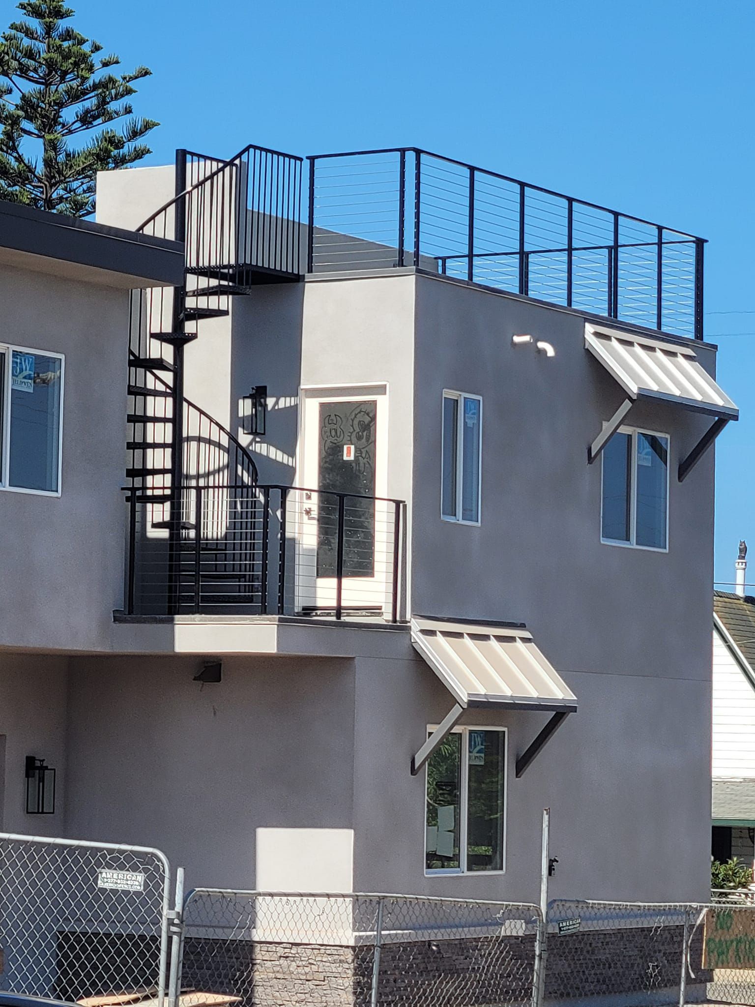 A house with a spiral staircase on the top of it