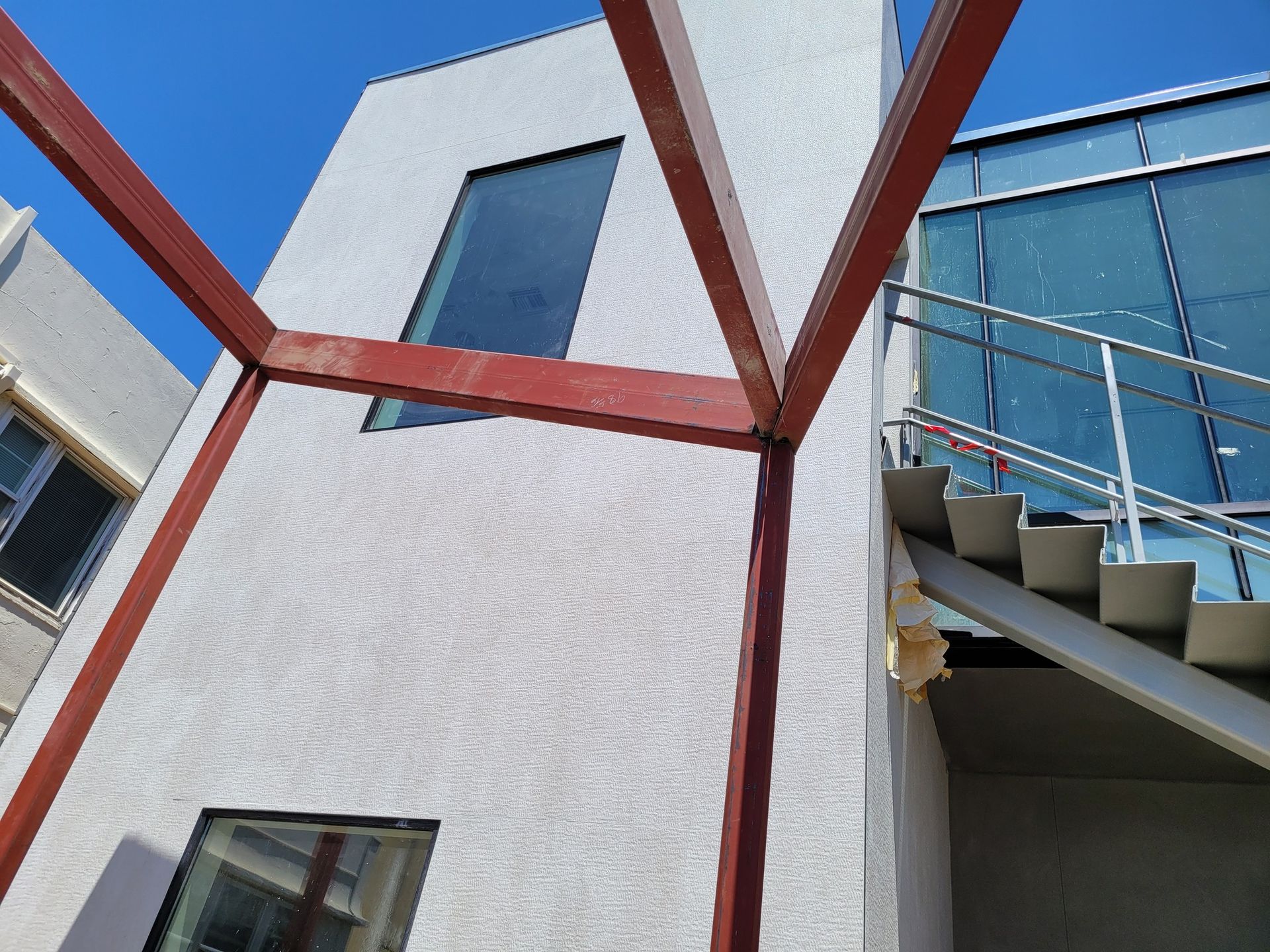 Looking up at a building with stairs leading up to it