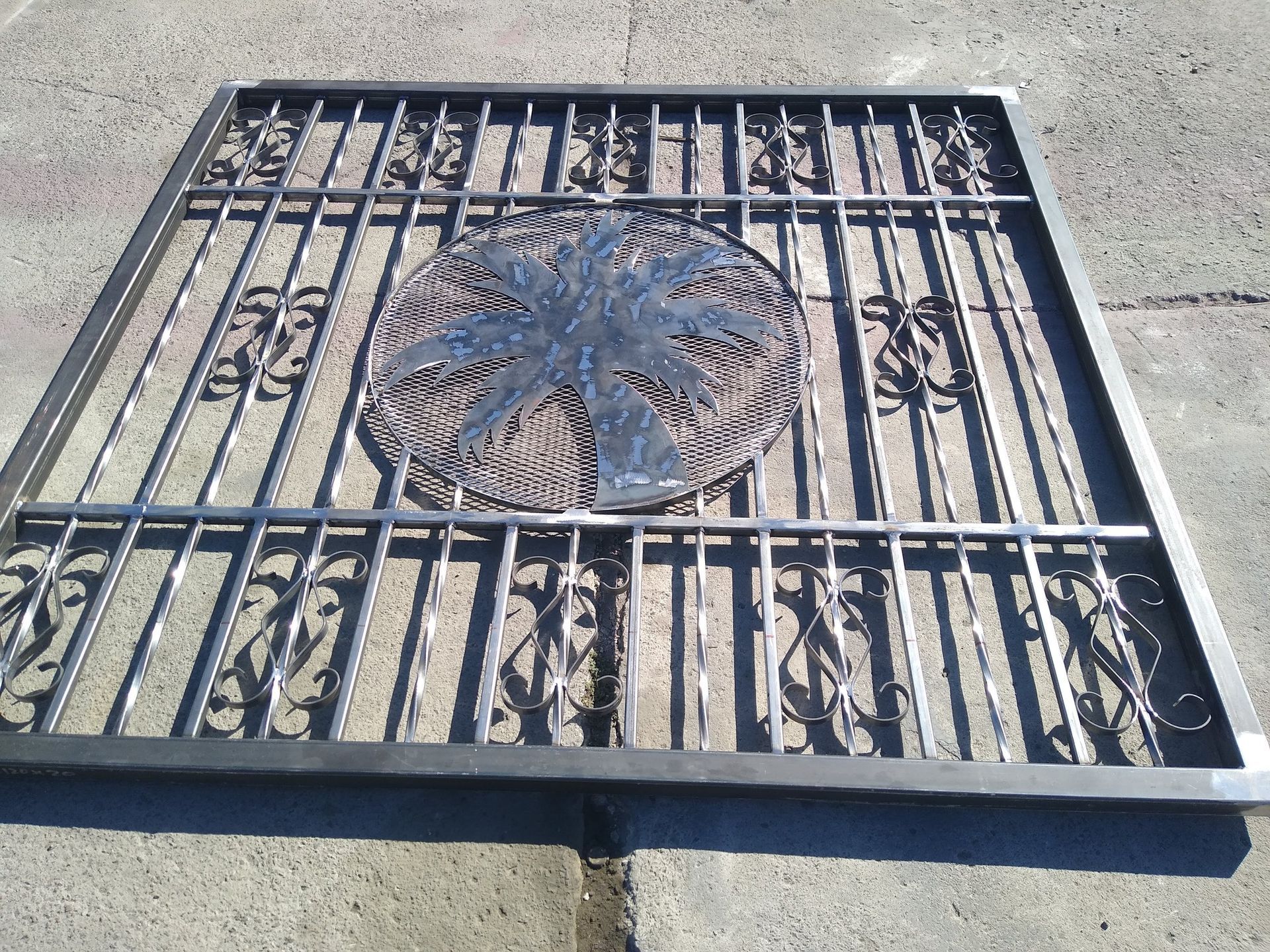 A wrought iron gate with a star on it