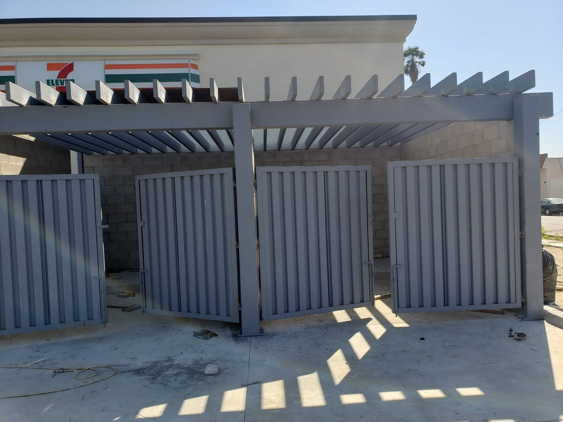 A 7 eleven store with a fence in front of it