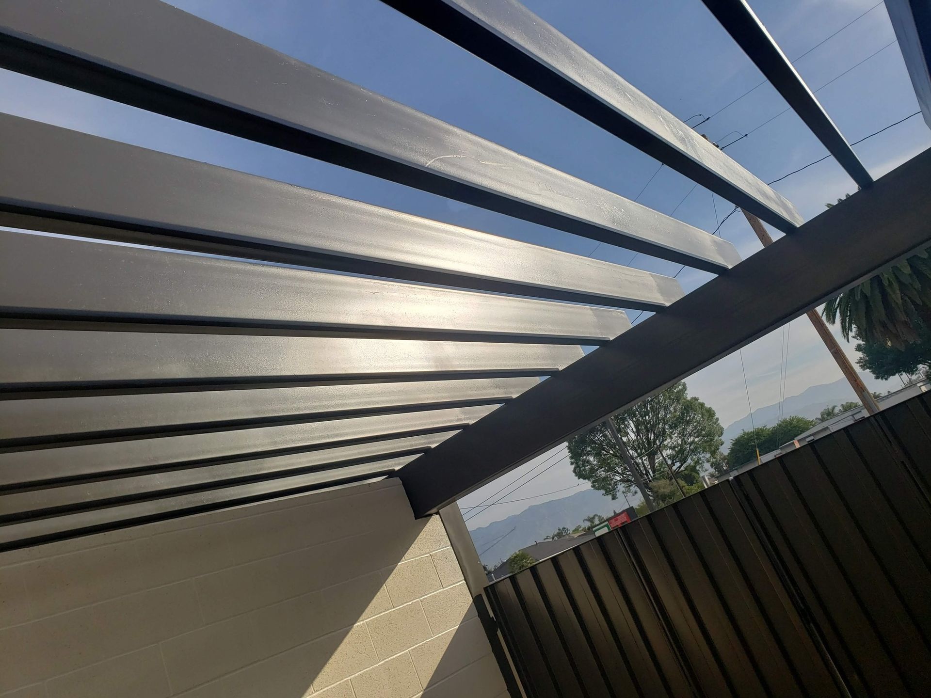 The sun is shining through the roof of a building.