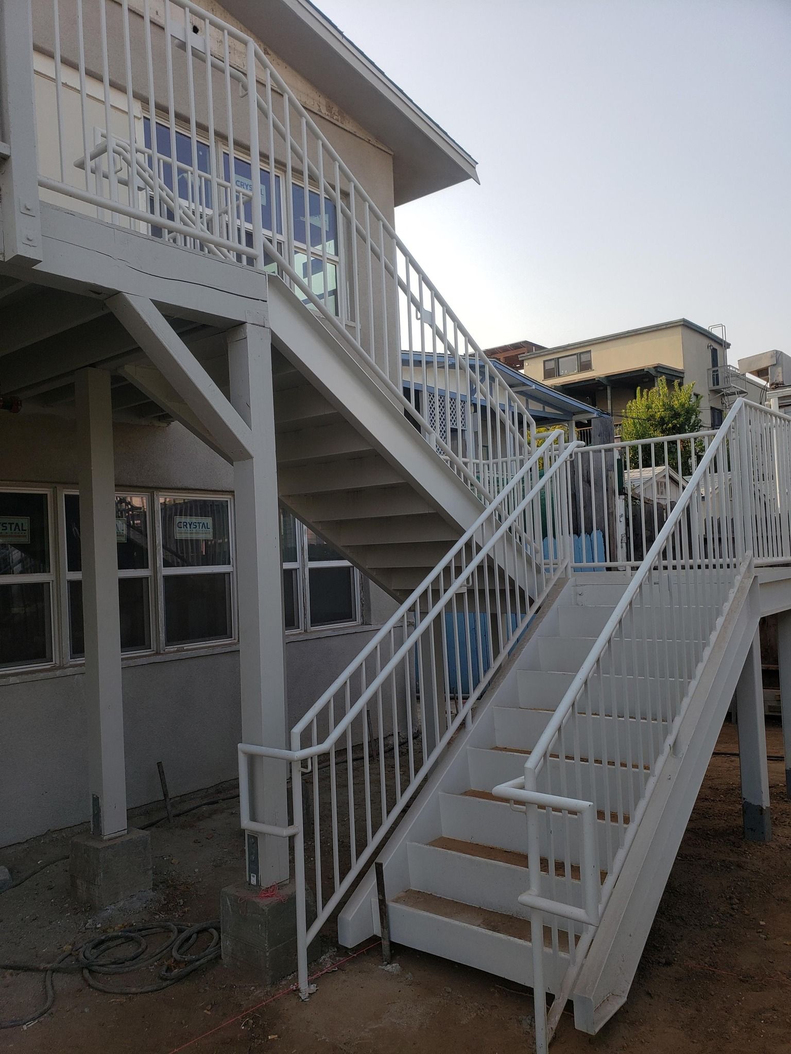 A set of white stairs leading up to a building