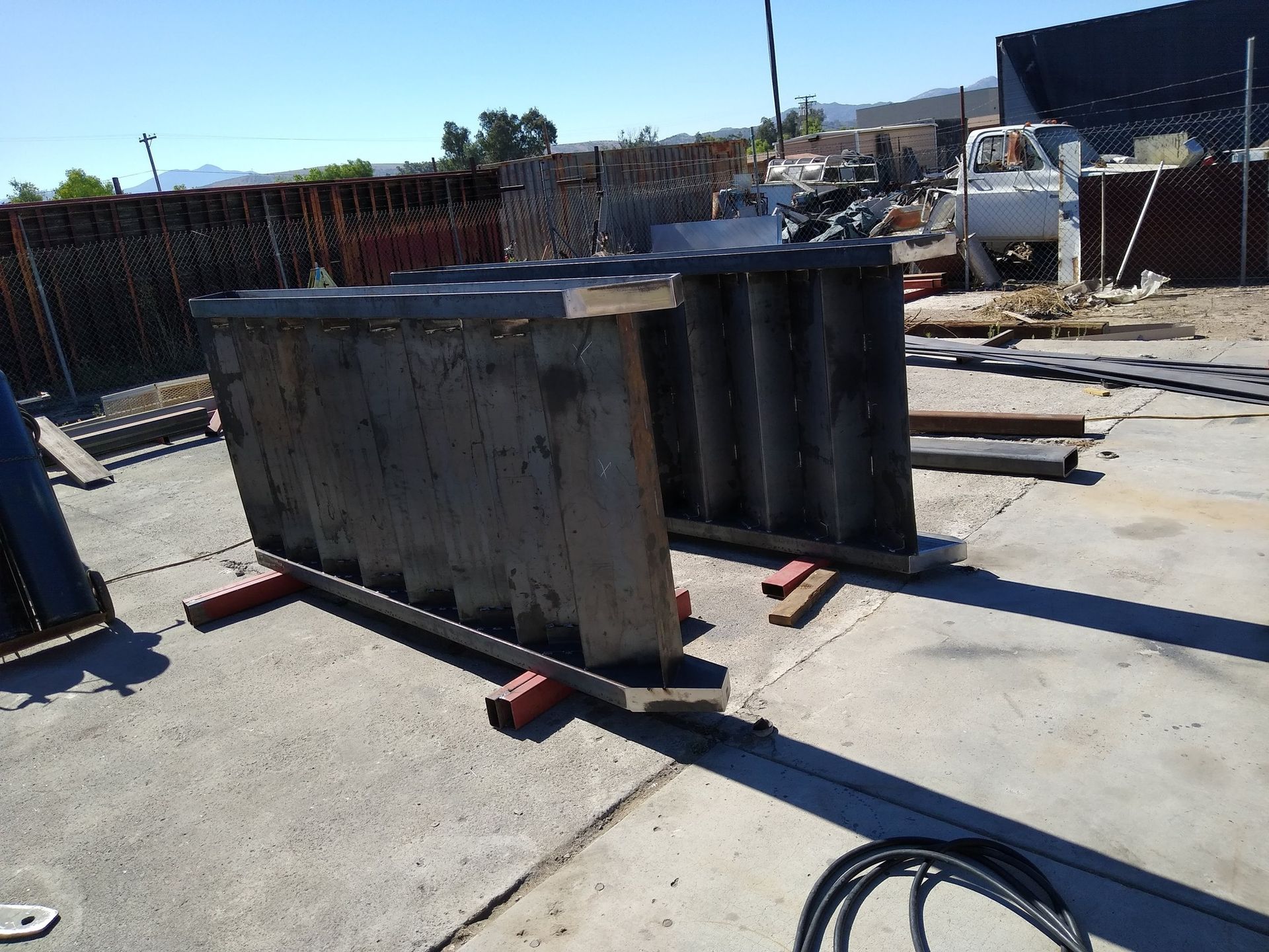 A large piece of wood is sitting on a concrete surface