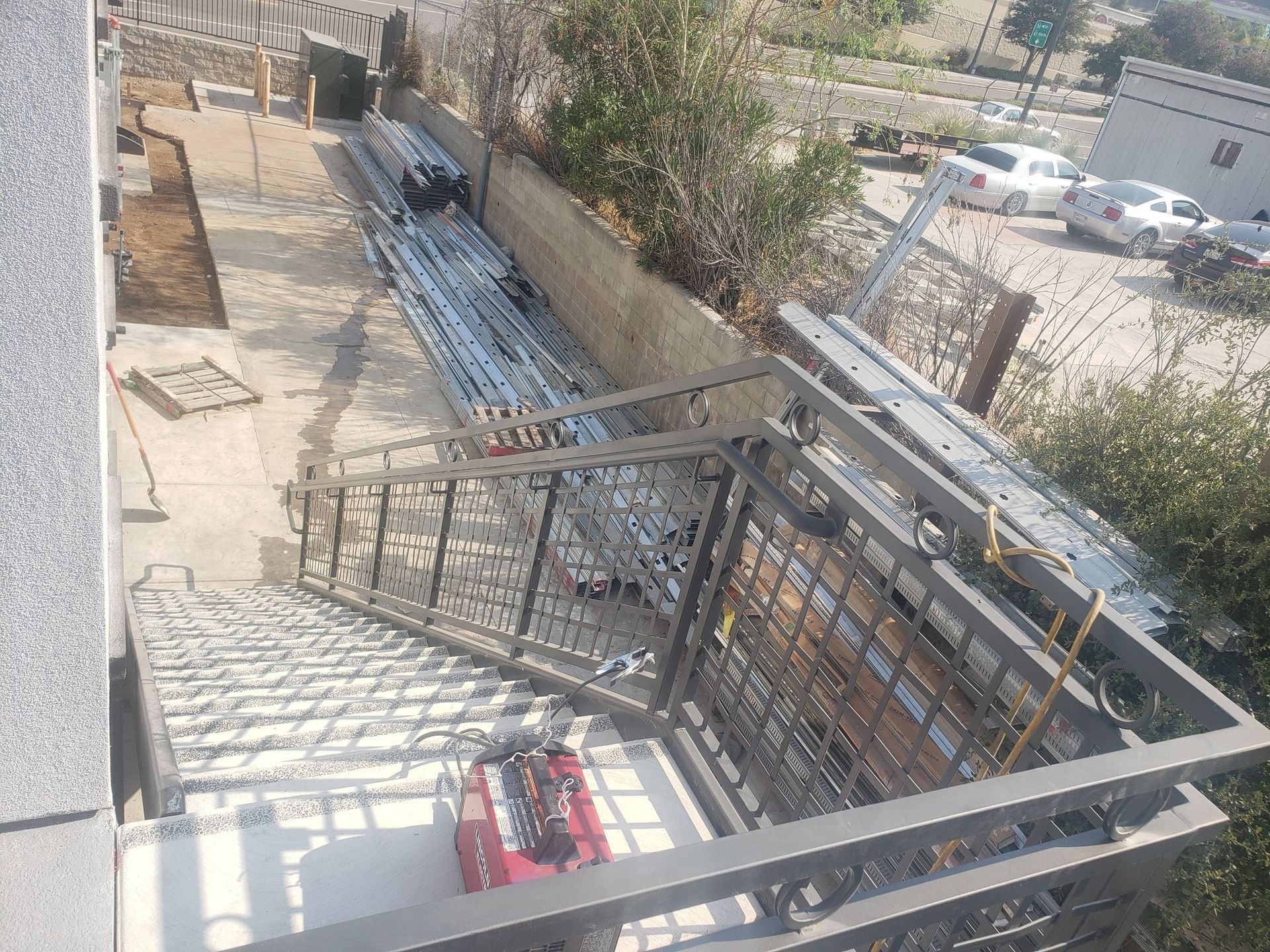 An aerial view of a balcony with a metal railing.