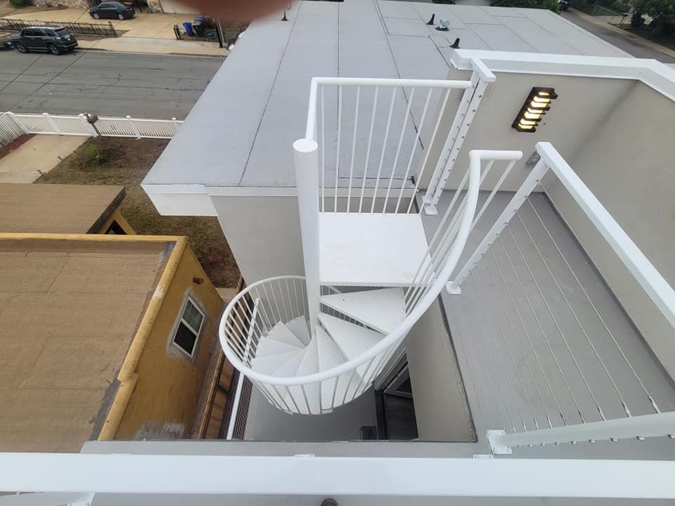 A spiral staircase on the roof of a building