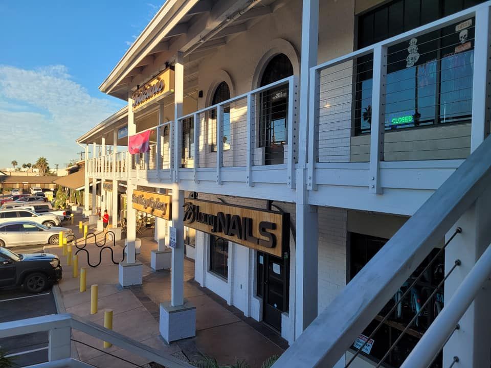 A building with a sign that says nails on it
