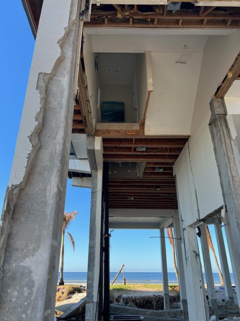 A building under construction with a view of the ocean