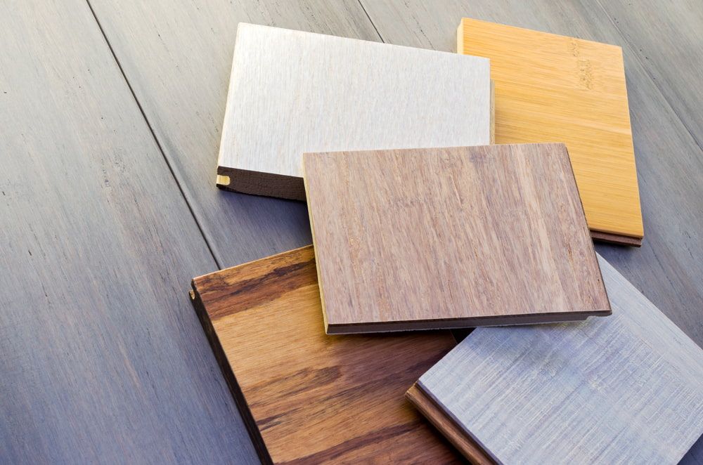 Wood Are Stacked On Top Of Each Other On A Wooden Table  — Corbett Brothers Flooring In Hunter Valley, NSW