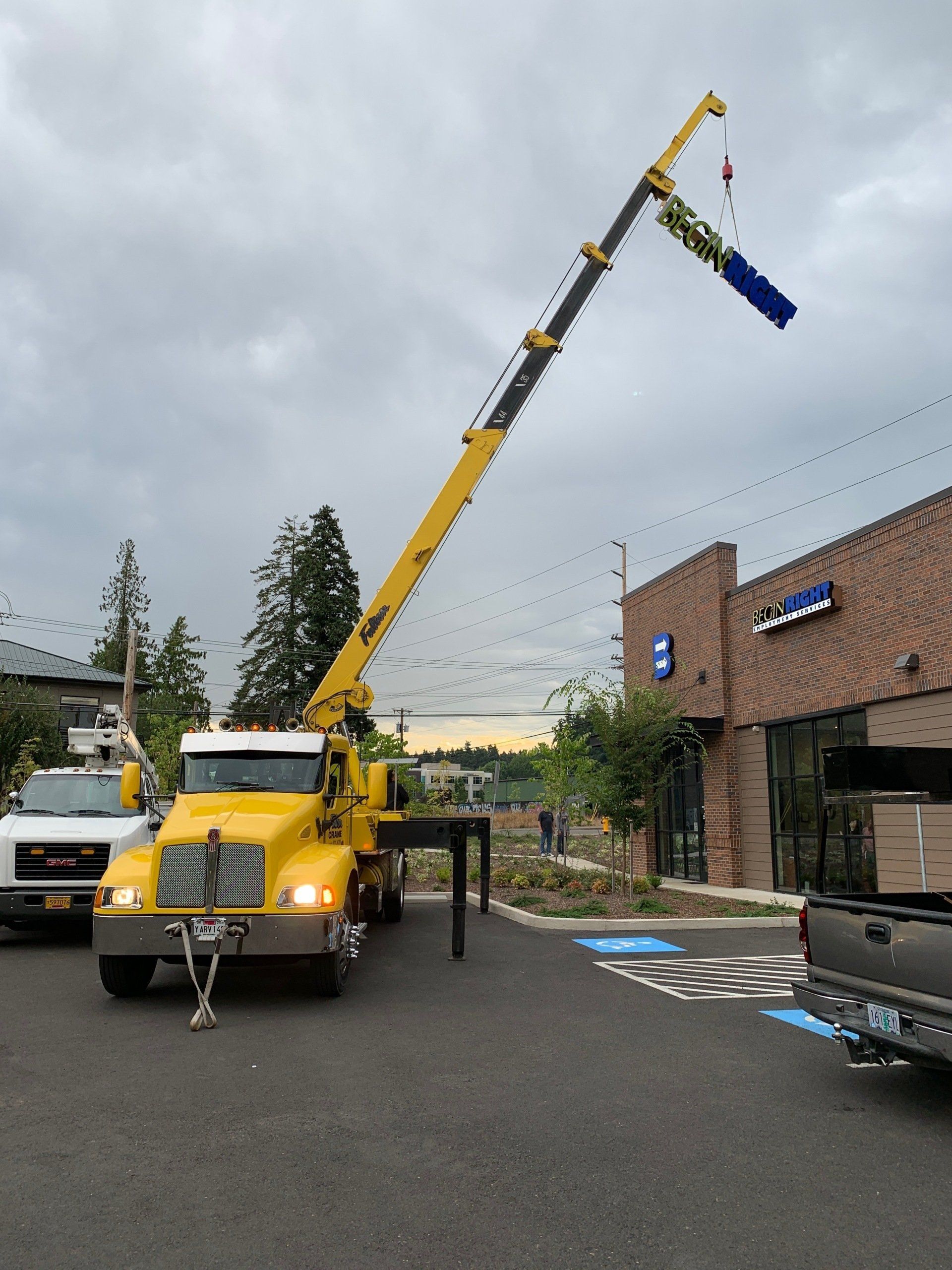Crane Truck Lifting A Signage — Beaverton, OR — Fulton Crane & Rigging