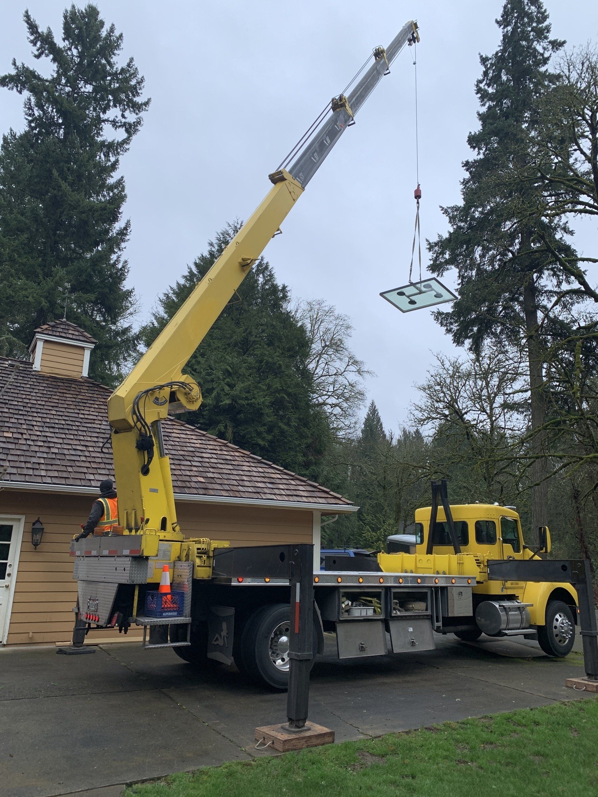 Yellow Mobile Crane Lifting A Glass — Beaverton, OR — Fulton Crane & Rigging