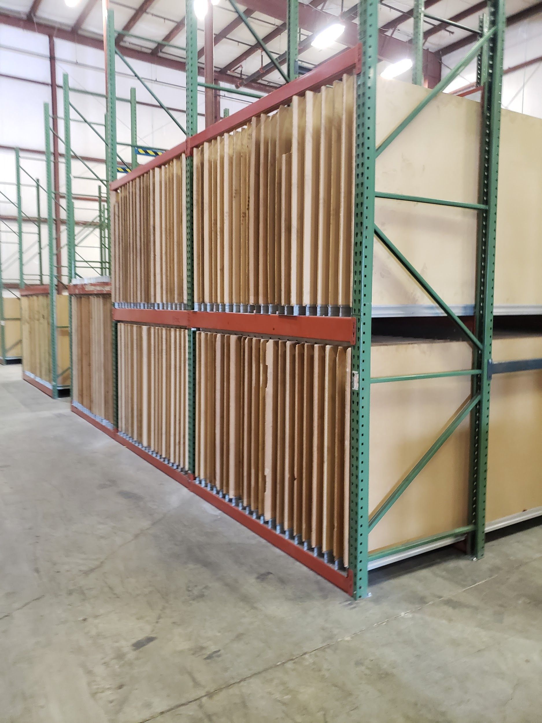 A warehouse filled with lots of wooden shelves