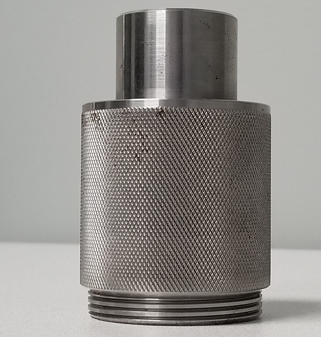 A close up of a metal object on a table.