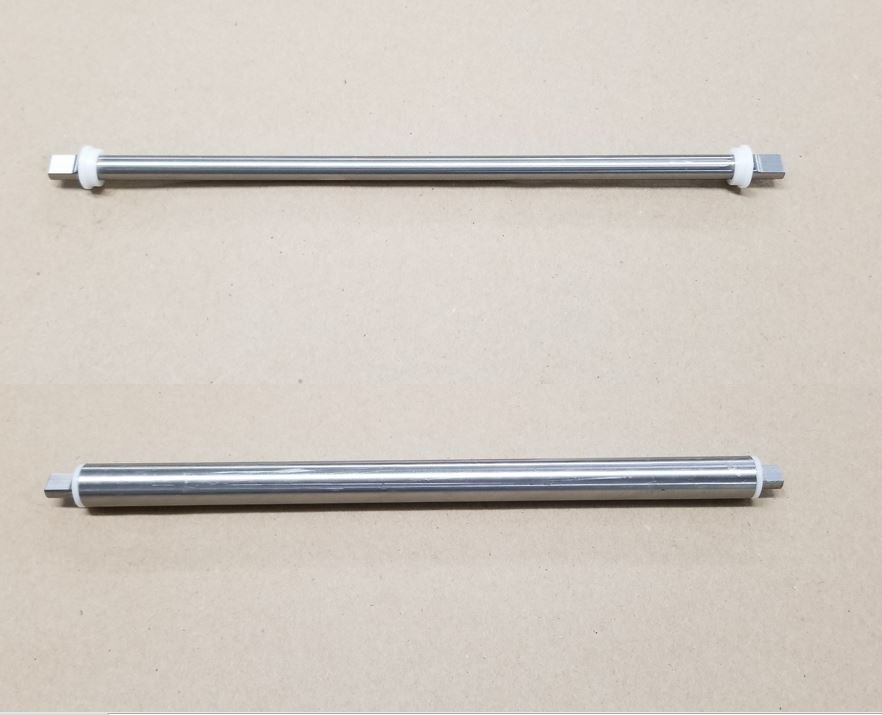 Two stainless steel rods are sitting next to each other on a table.