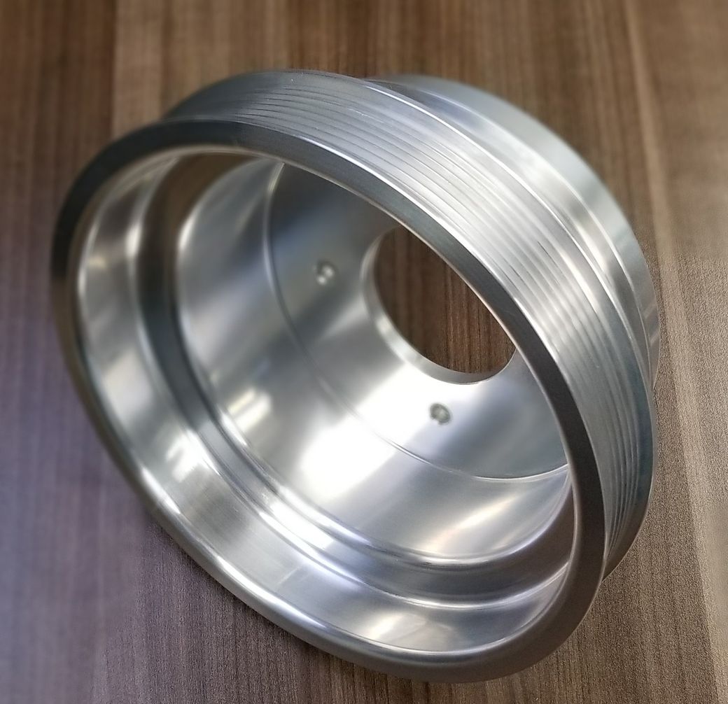 A metal ring is sitting on a wooden table